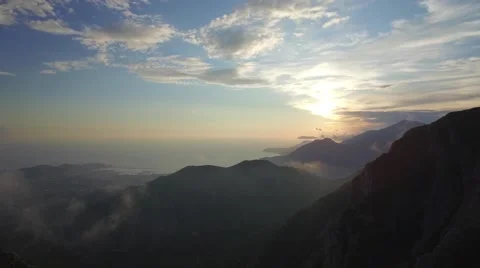 Flight to the sunset among the mountains Stock Footage 63999453