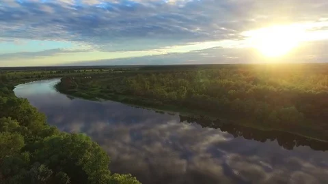 Flight at sunset over the river in summer. Video stock 82471928