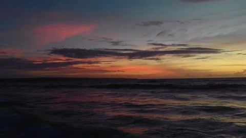 Flight at sunset overlooking the Indian Ocean in Bali Indonesia. Stock Footage 145894583