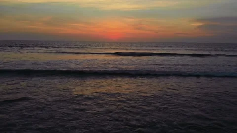 Flight at sunset overlooking the Indian Ocean in Bali Indonesia. Stock Footage 145894622