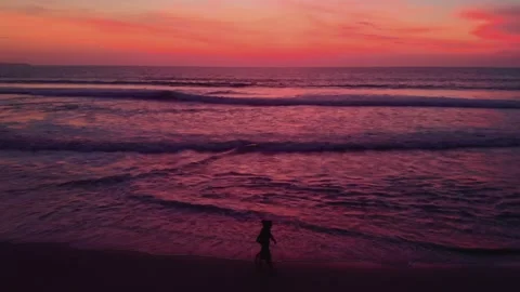 Flight at sunset overlooking the Indian Ocean in Bali Indonesia. Stock Footage 145894705