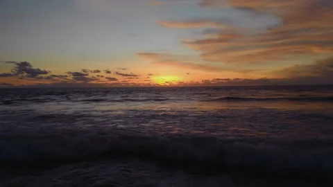 Flight at sunset overlooking the Indian Ocean in Bali Indonesia. Stock Footage 145894744
