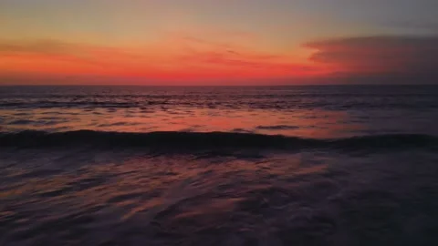 Flight at sunset overlooking the Indian Ocean in Bali Indonesia. Stock Footage 145894783