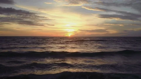 Flight at sunset overlooking the Indian Ocean in Bali Indonesia. Stock Footage 145894926