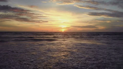 Flight at sunset overlooking the Indian Ocean in Bali Indonesia. Stock Footage 145895212