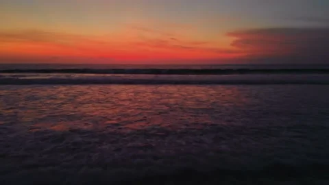 Flight at sunset overlooking the Indian Ocean in Bali Indonesia. Stock Footage 145895296