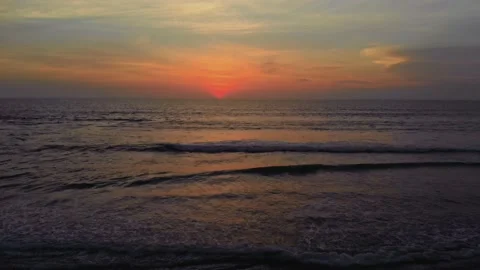 Flight at sunset overlooking the Indian Ocean in Bali Indonesia. Stock Footage 145895505