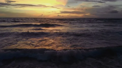 Flight at sunset overlooking the Indian Ocean in Bali Indonesia. Stock Footage 145895541