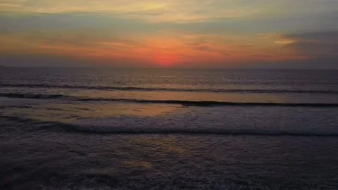 Flight at sunset overlooking the Indian Ocean in Bali Indonesia. Stock Footage 145895613