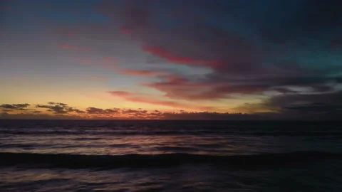 Flight at sunset overlooking the Indian Ocean in Bali Indonesia. Stock Footage 145895684