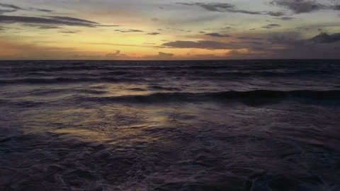 Flight at sunset overlooking the Indian Ocean in Bali Indonesia. Stock Footage 145896247