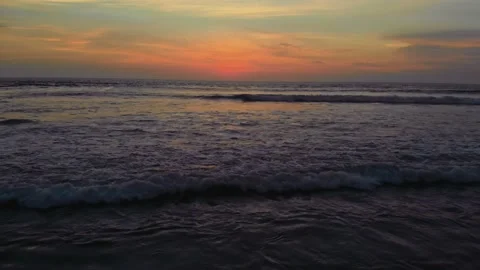 Flight at sunset overlooking the Indian Ocean in Bali Indonesia. Stock Footage 145897053