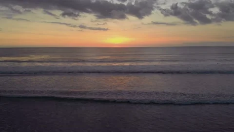 Flight at sunset overlooking the Indian Ocean in Bali Indonesia. Stock Footage 145897161