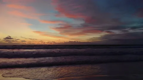 Flight at sunset overlooking the Indian Ocean in Bali Indonesia. Stock Footage 145897183