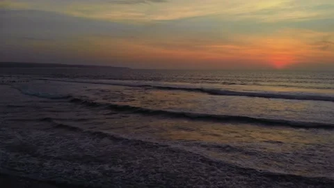 Flight at sunset overlooking the Indian Ocean in Bali Indonesia. Stock Footage 145897198