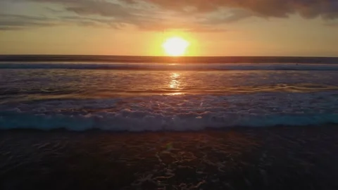 Flight at sunset overlooking the Indian Ocean in Bali Indonesia. Stock Footage 145897362