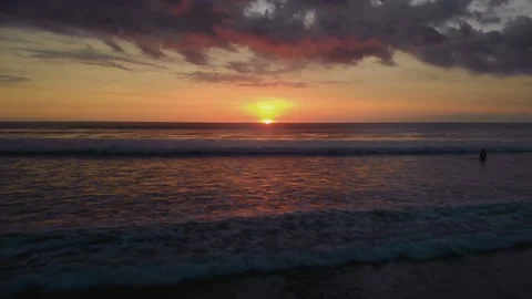 Flight at sunset overlooking the Indian Ocean in Bali Indonesia. Stock Footage 145897384