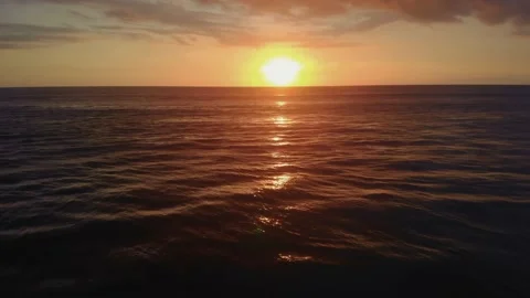 Flight at sunset overlooking the Indian Ocean in Bali Indonesia. Stock Footage 145897468