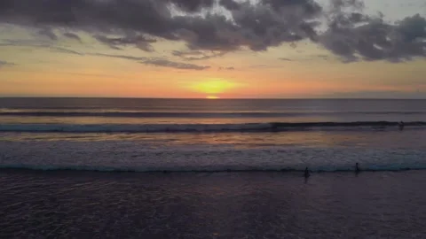 Flight at sunset overlooking the Indian Ocean in Bali Indonesia. Stock Footage 145897535