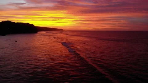 Flight at sunset overlooking the Indian Ocean in Bali Indonesia. Stock Footage 149348696