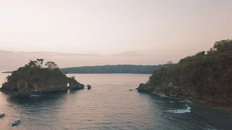 Flight in the sunset time in between the islands in the golden colours Stock Footage 101659796