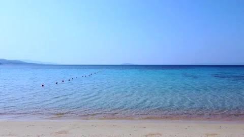 Flight through beach bar on sand beach with wooden umbrellas Stock Footage 138960658