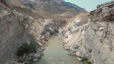 Flight Through Canyon With Coarse River and Many Rock Layers Video stock 134423243