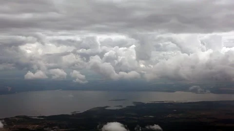 Flight through clouds above river Stock Footage 52850845
