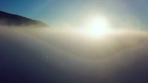 Flight through the clouds above the river Video stock 107939323