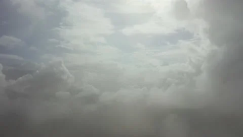 Flight through the clouds. View from an airplane at high altitude Stock Footage