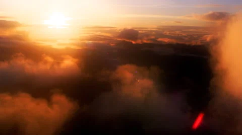 Flight through colorful sunset clouds, close-up passenger POV Stock Footage 59449783