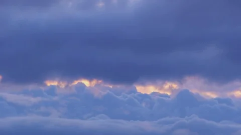 Flight through dark blue, purple fluffy clouds. view from the plane. Ultra HD Stock Footage 106015474