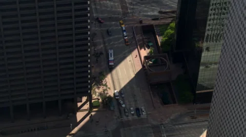 Flight through downtown Houston, with steep look down into streets. Shot in Stock Footage 59539320