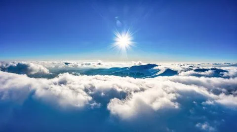 Flight through evening sky with clouds over mountain Stock-Fotos