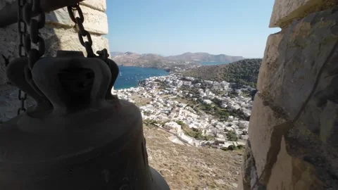 Flight through a fortress wall window past a church bell, to a village Stock Footage 247077671