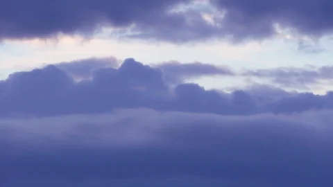 Flight through light blue, puffy fluffy clouds. view from the plane. Ultra HD Stock-Footage 106015353