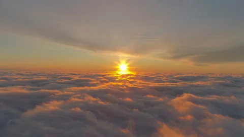 Flight through moving cloudscape with beautiful sun rays. Sunset in the sky. Stock Footage 125616127