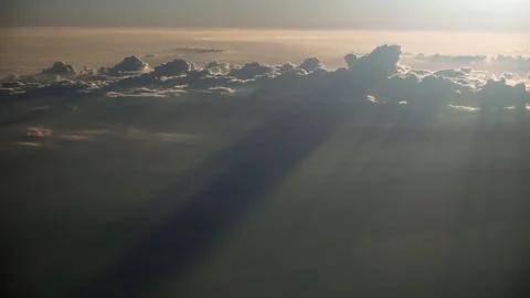 Flight through moving cloudscape with beautiful sun rays. Airplane sunset view. 스톡 동영상 157206739