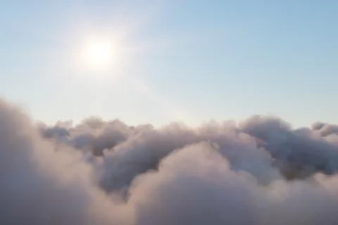 Flight through moving cloudscape with beautiful sun rays. Beautiful realistic Stock Illustration