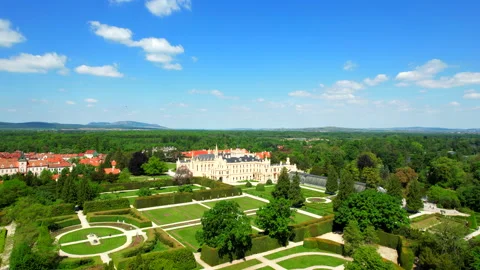 Flight through park and over castle Lednice Chateau summer day Stock Footage 194680023