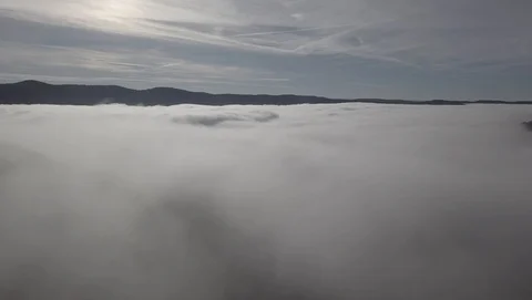 Flight through a sea of cloud 2,7k ungraded Stock Footage 105851565