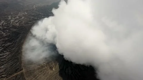 Flight through the smoke from the vent of the volcano. Volcano in indonesia. Stock Footage 237398118