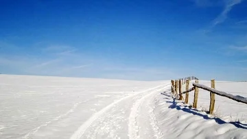 Flight through a snowy landscape in the sun Stock Footage 85637703