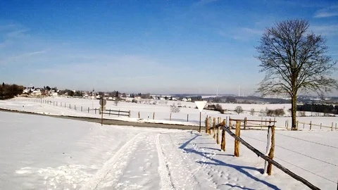 Flight through a snowy landscape in the sun Stock Footage 85637719