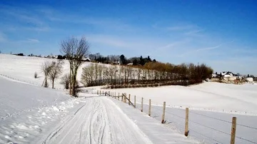 Flight through a snowy landscape in the sun Stock Footage 85637738