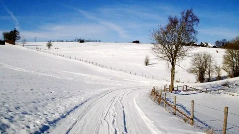 Flight through a snowy landscape in the sun Stock Footage 85637742
