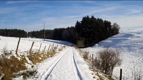 Flight through a snowy landscape in the sun Stock Footage 85637762