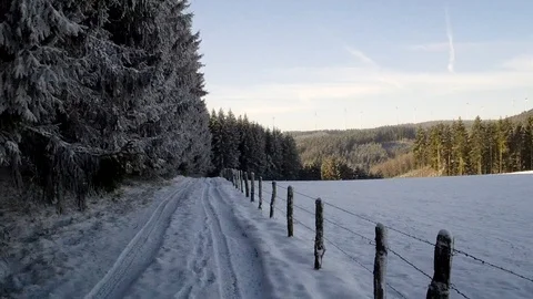 Flight through a snowy landscape in the sun Stock Footage 85637839