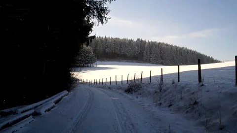 Flight through a snowy landscape in the sun Stock Footage 85637846