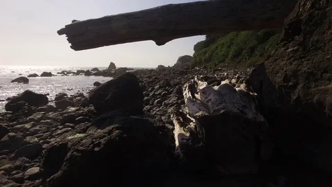 Flight through tight space on rocky beach. Stock Footage 70334947